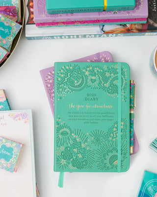 Intrinsic Year for Abundance Diary Planner in tahitian turquoise with soulful journaling prompts, gratitude record & habit tracking.