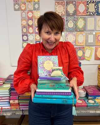 Adèle Basheer with a Turquoise Lovers Mystery Bundle from the Intrinsic Archive Sale, featuring vintage gems, display samples, and end-of-line pieces from past journals, stationery, travel, ceramic, jewellery, accessories or homewares collections.