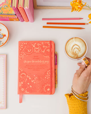 Inspirational Peach orange 'Year for Radiating Joy' Diary organiser by Intrinsic with personal growth tools & motivational messages by Adèle Basheer to crate a life you love.