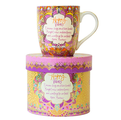 Intrinsic Happy Vibes yellow and pink mug adorned with sparkles of gold foil and inspirational Adèle Basheer quote and motivational message to dream big and live bold. Beautifully Gift boxed.