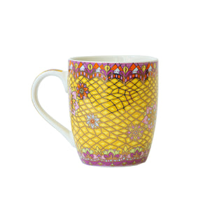 Intricate hand-illustrated pattern on the Intrinsic Happy Vibes yellow and pink mug adorned with inspirational Adèle Basheer quote and motivational message