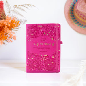 Pink stationery diary planner with  goals, gratitude, habits, self care and intentions