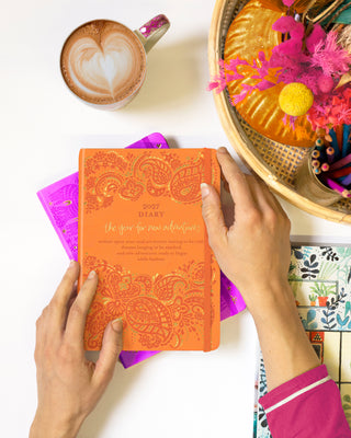 2027 Orange Diary Planner with inspirational quote for new adventures