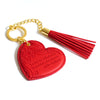 Inspirational vegan leather heart shaped bright red keychain with gold chain and scarlet red tassel. Designed in South Australia. Motivational quote by Adèle Basheer.