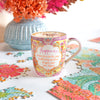 Australian Inspirational Brand Intrinsic happiness ceramic mug with pink, gold and yellow illustrations 