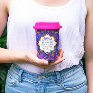 Intrinsic Destiny ceramic reusable travel coffee cup with multi-colour star design, gold foiling and hot pink silicone lid. Featuring inspirational soulful quote by Adèle Basheer. 