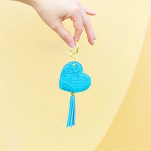 Perfect small gift for friends and family. Bright coloured sky blue key holder with vegan leather floral pattern and bright blue tassel. Featuring heartfelt quote by Adèle Basheer.