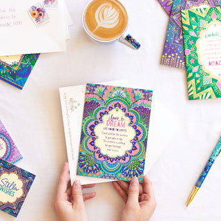 Intrinsic ‘dare to dream’ celebration themed greeting card with envelope. Unique colourful aspirational card with gold foil and inspirational quote on cover by Adele Basheer. Greeting card for someone who just graduated, house-warming greeting card, birthday card. 