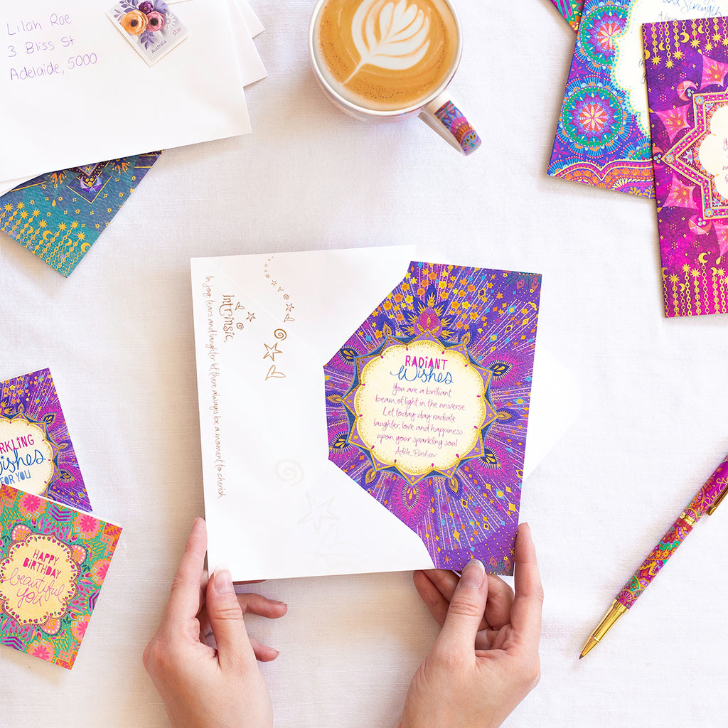 Intrinsic 'Stellar Wishes' motivation themed birthday and special occasion greeting card with envelope. Colourful hand illustrated good luck card with gold foil and inspirational quote on cover by Adele Basheer. Unique greeting card for someone celebrating a milestone, birthday, anniversary or new beginnings. 